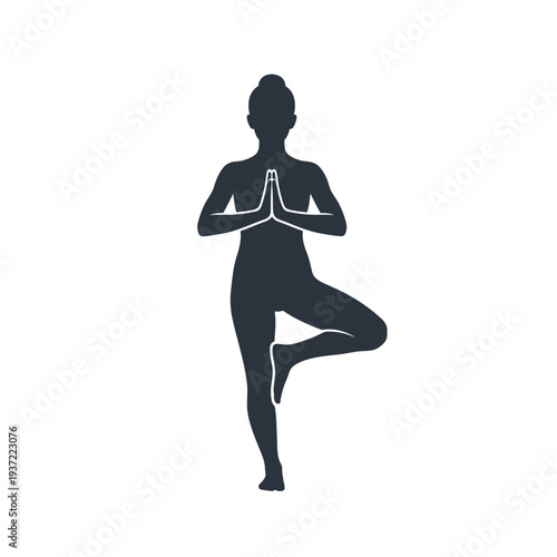 Silhouette of a woman in Tree Pose (Vrikshasana) with hands in prayer, embodying strength, grace, and yoga