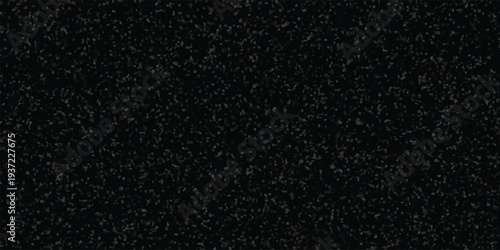 Dark granular mosaic background with small irregular grey polygonal shapes on a black base for subtle texture