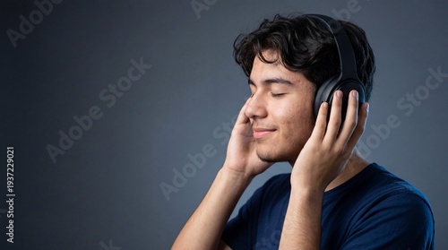 Calm Hispanic teenager with headphones enjoying a peaceful moment.
