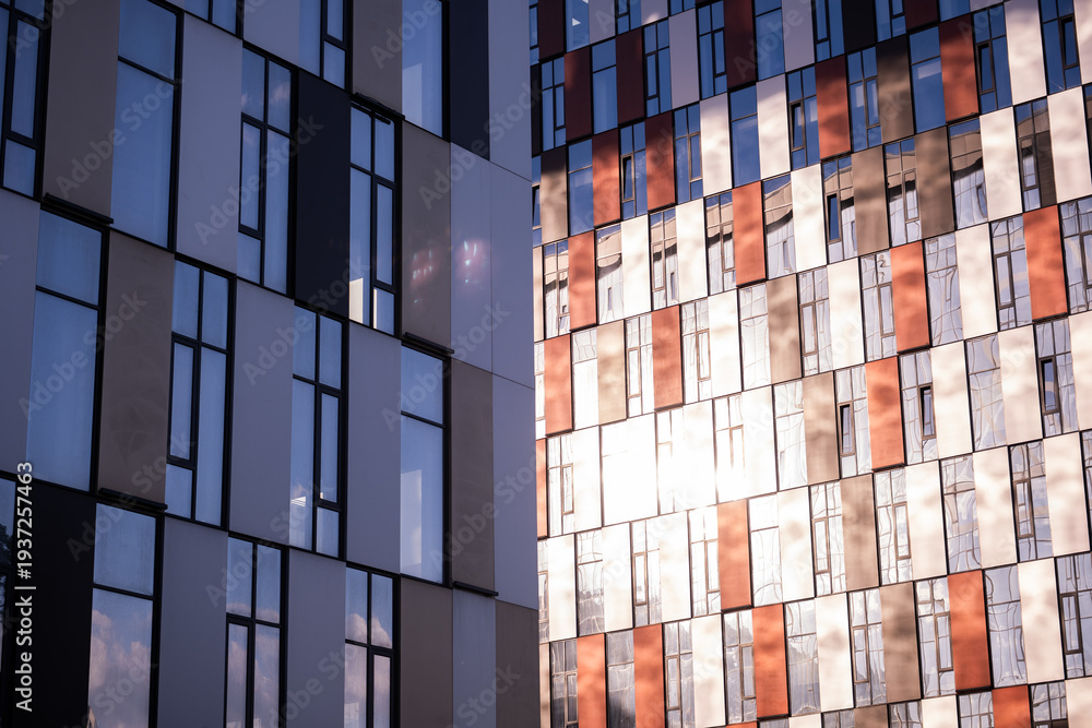 Fototapeta premium Modern architecture showing glass facades and abstract patterns on new high-rise buildings