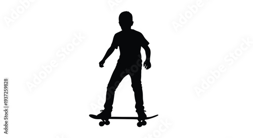 Young boy riding a skateboard full body shot black silhouette