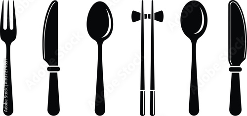 Set of tableware utensils including fork knife spoons and chopsticks