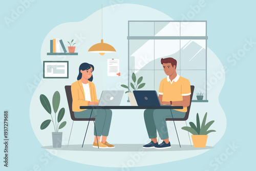 Two colleagues collaborating in a brightly lit modern office workspace