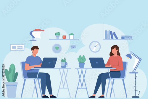 Two people working on laptops at a shared desk in a modern office