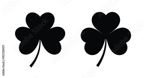 Two black clover silhouettes against a white background silhouette