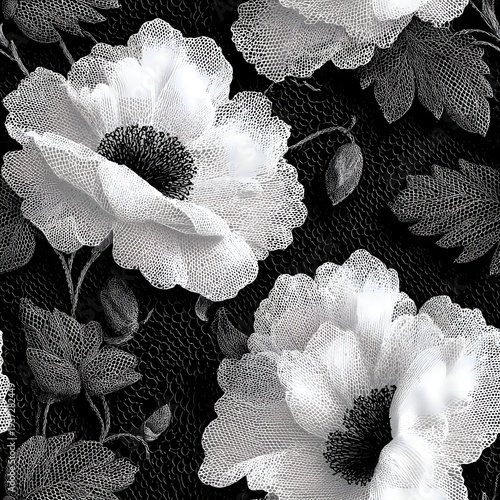 A black and white floral pattern featuring large white flowers with dark centers and leaves on a textured background