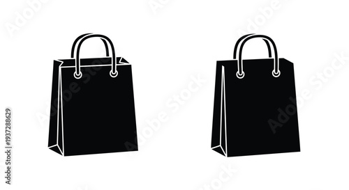 Two black paper shopping bags with handles isolated on a white background