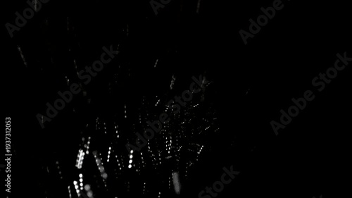 Snow flies on a black background, heavy snowfall, a snowstorm. A winter hurricane with wind, a snow squall.