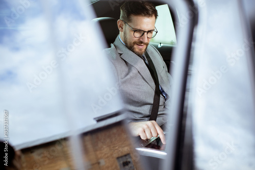 Businessman working on phon...