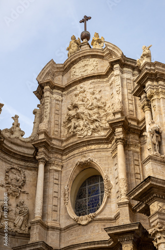 Valencia Cathedral and Miguelete Tower (Micalet) from Plaza de la Reina, Spain. A Gothic masterpiece standing tall, framed by the lively ambiance of one of Valencia’s most iconic squares.