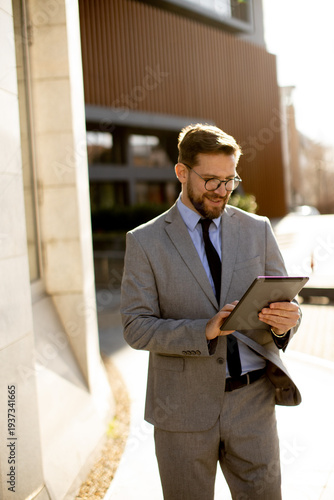 Businessman using tablet ou...