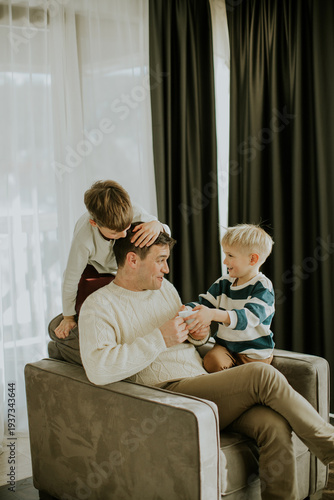 Father and two children int...
