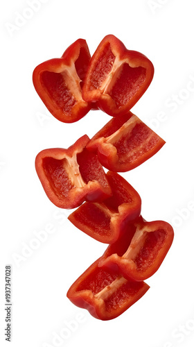 Red bell pepper pieces falling on transparent background