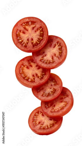 Fresh falling tomato slices creating a healthy food concept