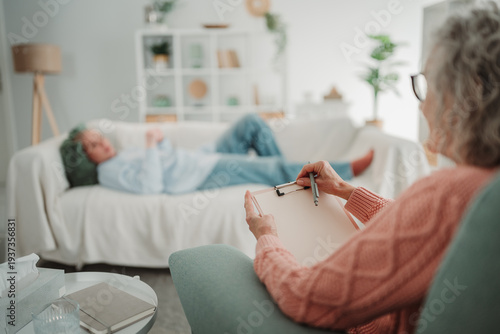 Wallpaper Mural Patient receiving psychotherapy from female counselor taking notes Torontodigital.ca