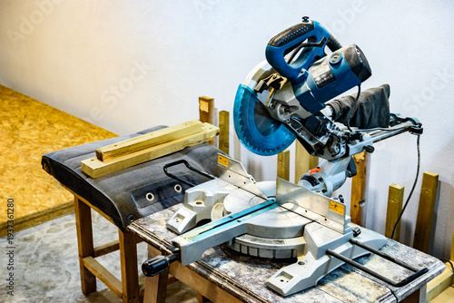 Φωτογραφία A professional circular saw with a miter in the woodcraft carpentry workshop