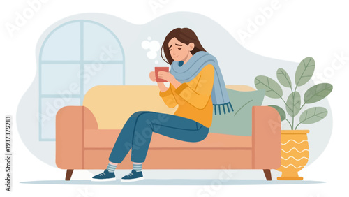 Cozy woman enjoying hot beverage on comfortable couch at home