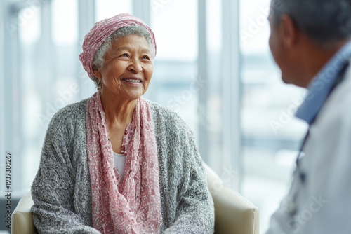 Elderly woman cancer patient headscarf senior woman female patient doctor medical consultation hospital healthcare hope support empathy smiling conversation recovery treatment counseling oncology