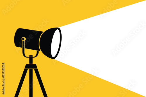 Spotlight Shining Bright on Yellow Background with Tripod Stand