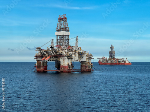 Offshore oil and gas drilling platform, Semi-submersible oil rig, offshore extraction platform and drillship operating in the open ocean during deepwater exploration. Global energy market instability 