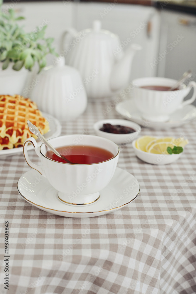 Fototapeta premium breakfast with tea and a homemade Belgian waffles