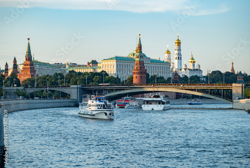 Photos Moscow Kremlin and river boats navigating Moskva River at sunset