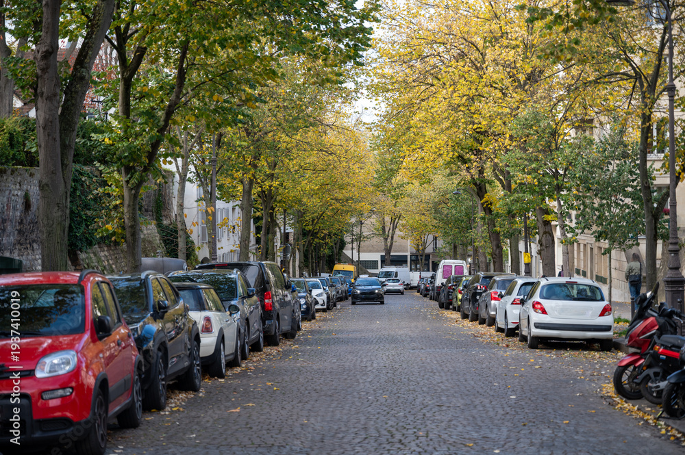 Obraz premium Walking on Montmartre hilly historical artistic district of Paris with famous buildings and narrow streets, tourists destination in France