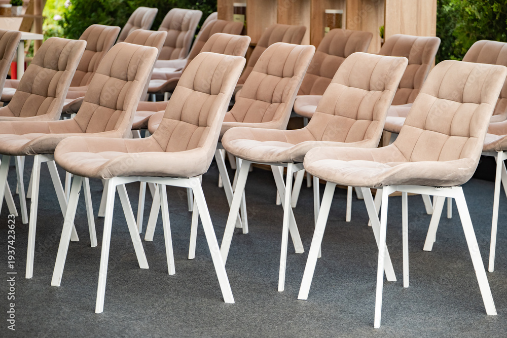 Fototapeta premium Empty chairs lining up in rows ready for a conference or corporate meeting