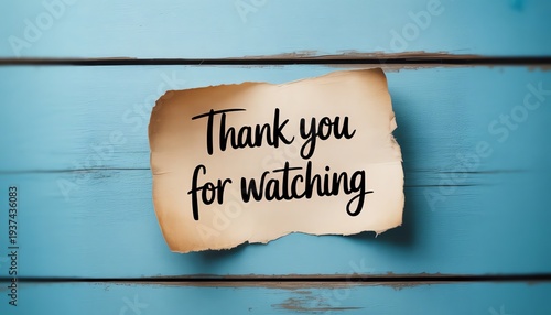 Thank You For Watching Message on Rustic Vintage Paper, Blue Wooden Background. Gratitude and Appreciation Concept.