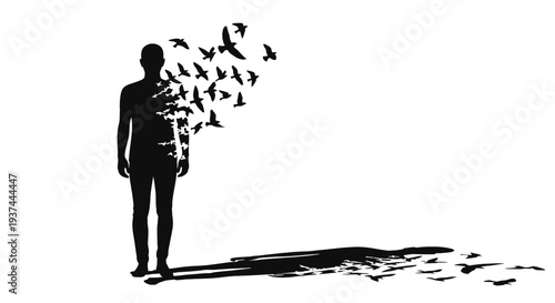Silhouette of man with birds escaping.