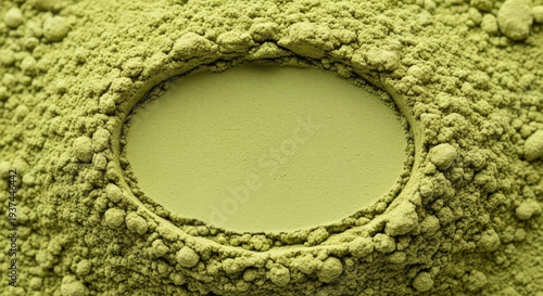 A close-up of green matcha powder with a circular depression
