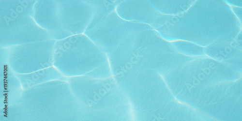 Bild auf Leinwand Abstract view of turquoise water with sunlight creating shimmering patterns