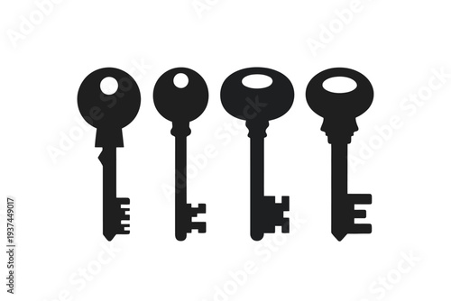 Four black antique keys are lined up against a plain white background, showcasing their distinct shapes and sizes.