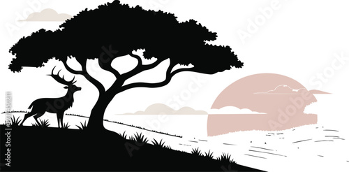 Serene savannah landscape with a deer standing under a tree at sunset