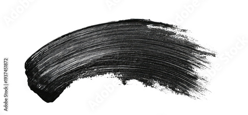 Curved, textured, grey stroke on black background, resembling a cosmetic application