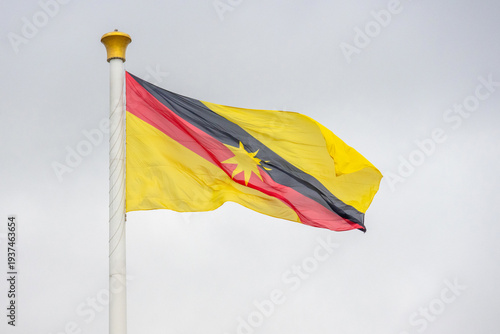 Fotografie Giant Sarawak flag is waving on the flagpole.