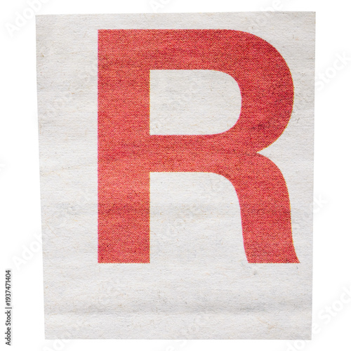 Red letter R on white background cut out from newspaper, single ransom letter isolated for collage
