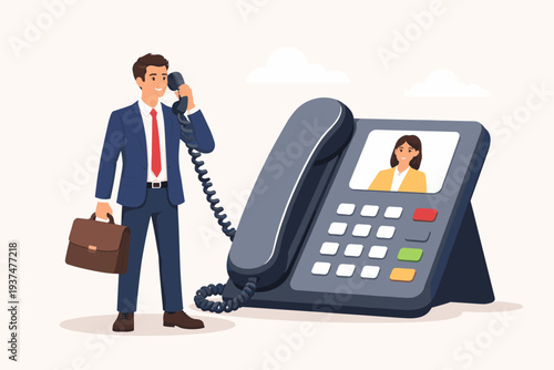 Smart Businessman in a Suit Holding a Briefcase and Talking on a Large Desk Phone with a Video Screen Showing a Woman, Concept of Job Interview, Remote Business Meeting, and Video Call Technology
