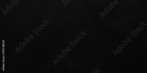 Dark charcoal black slate texture with fine grainy grit for industrial background or vintage overlay design