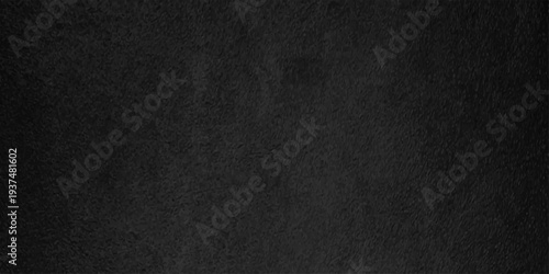 Dark charcoal black slate texture with fine grainy grit for industrial background or vintage overlay design
