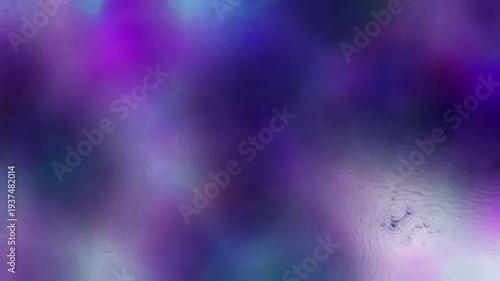 Dynamic abstract motion graphics featuring fluid liquid-like textures flowing across a foggy glass surface with soft blurred floral colors behind it. Dreamy organic movement with vibrant gradients and