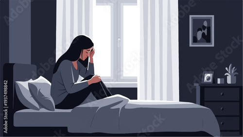 Woman sits on a bed, holding her head in despair near a bright window