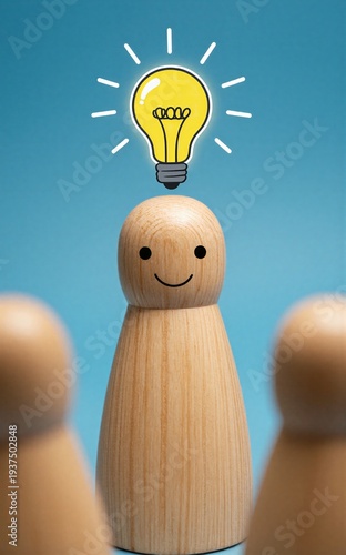 Wooden figure smiles as a glowing lightbulb idea shines above its