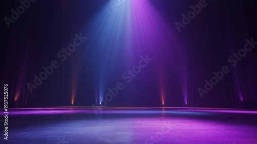 Empty stage with colorful spotlights and atmospheric haze.