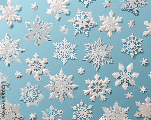 Variety of white paper snowflakes scattered on a light blue background