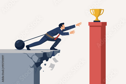 Businessman with Ball and Chain Reaching for Golden Trophy on Pillar While Cliff Crumbles, Concept of Business Failure, Bad Planning, Mismanagement, and Obstacles to Success, Ambition and Risk.