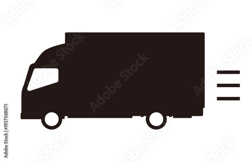 走る大きなトラックのシルエット