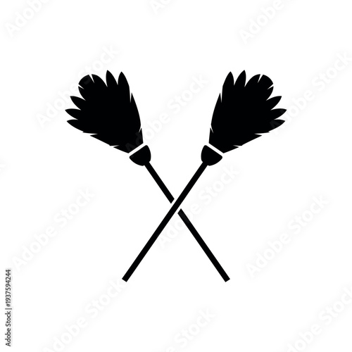 Crossed feather dusters black silhouette icon.
