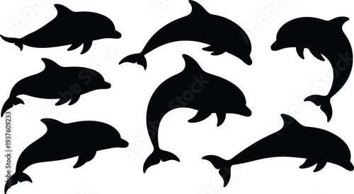 Black silhouettes of multiple dolphins jumping