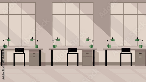 Modern office workspace with multiple desks and green lamps